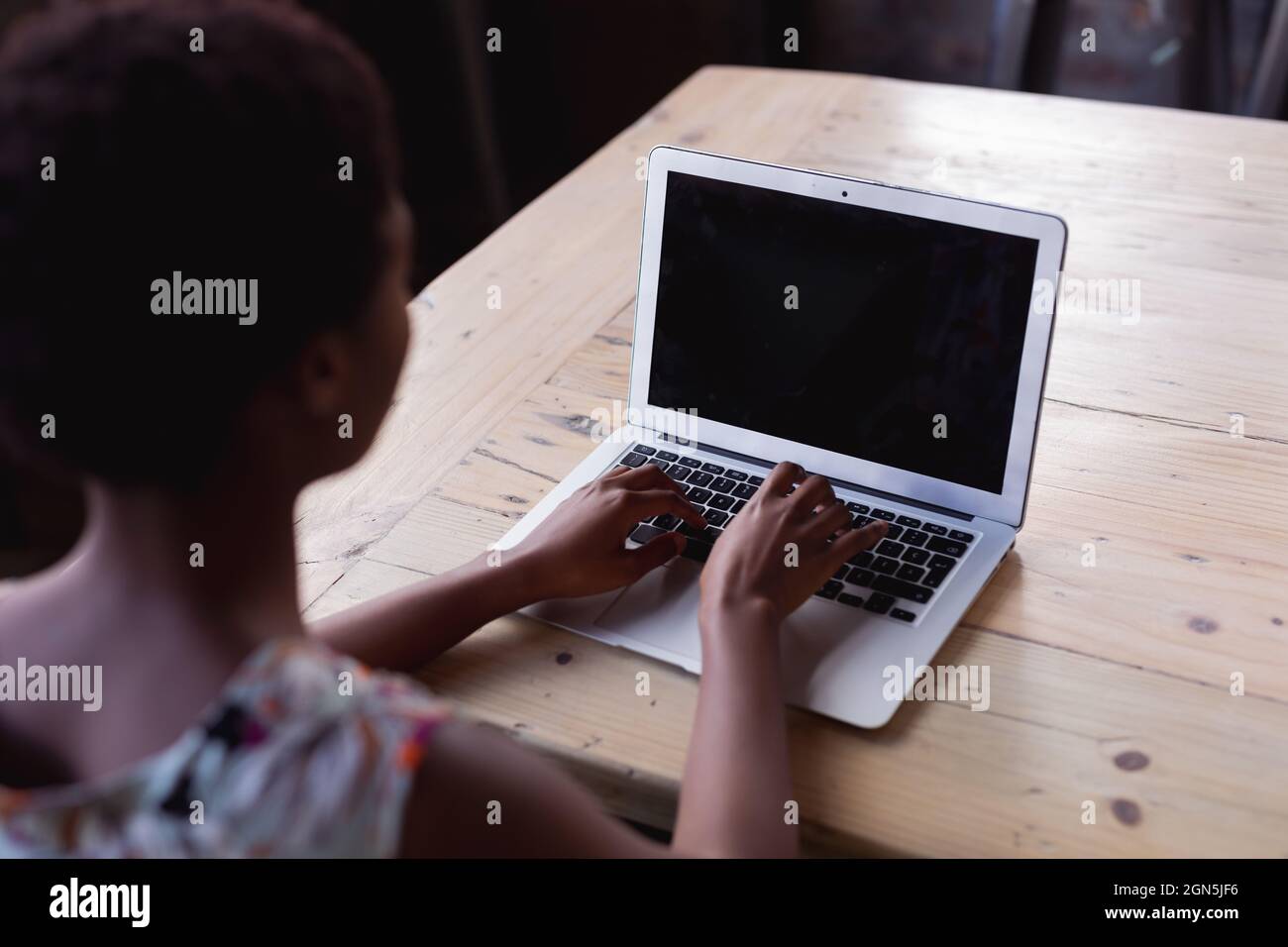 Rear view african woman using hi-res stock photography and images - Alamy