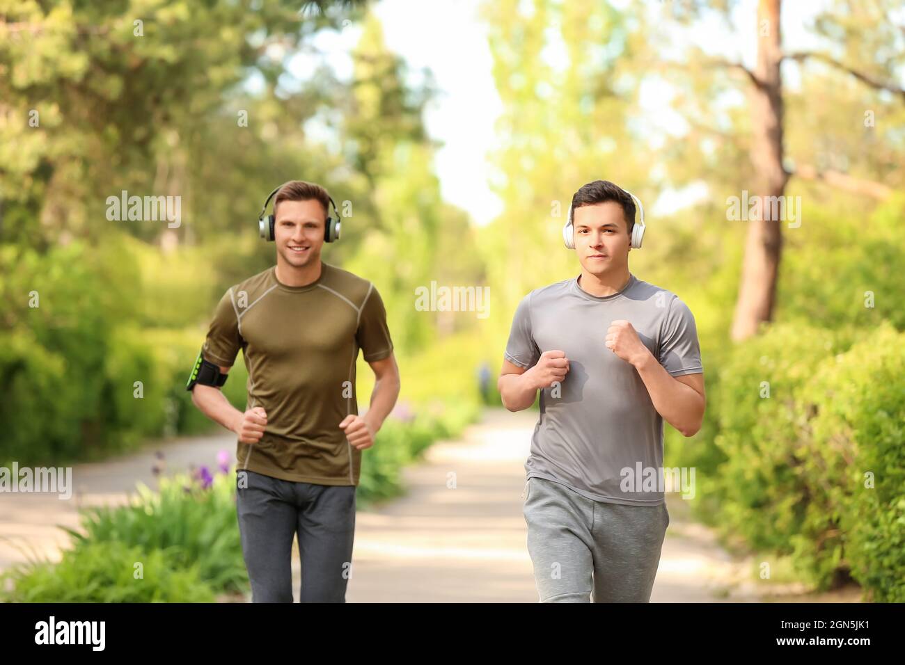 Sporty young men headphones hi-res stock photography and images - Alamy