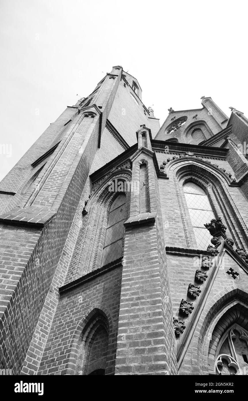 POZNAN, POLAND - May 22, 2017: A low angle grayscale shot of a church ...