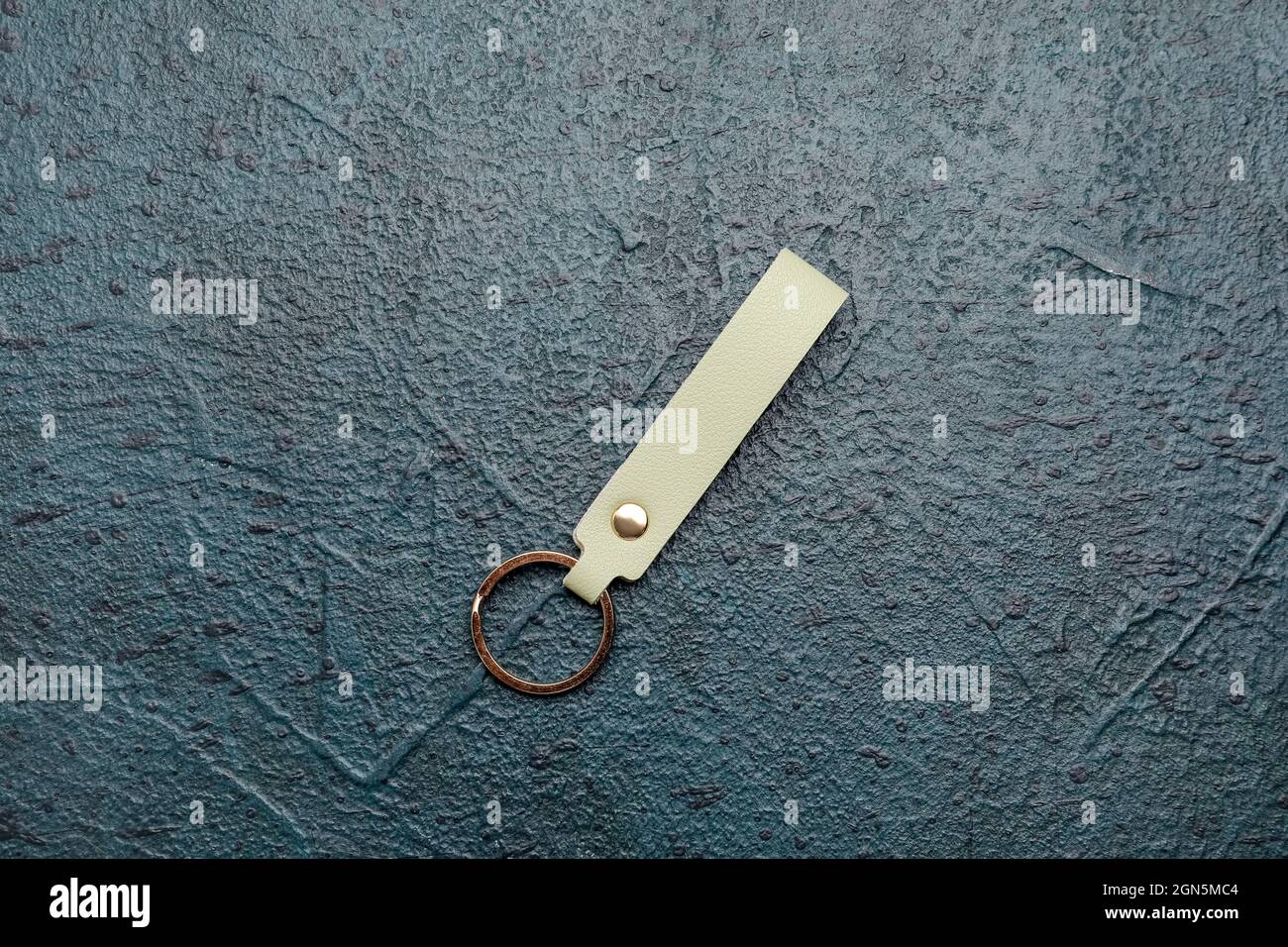 Leather keychain on dark background Stock Photo