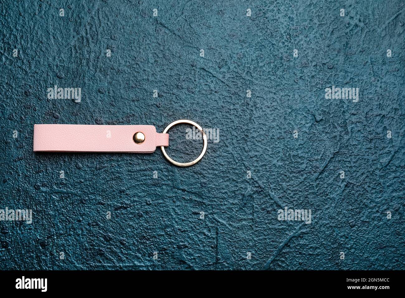 Leather keychain on dark background Stock Photo