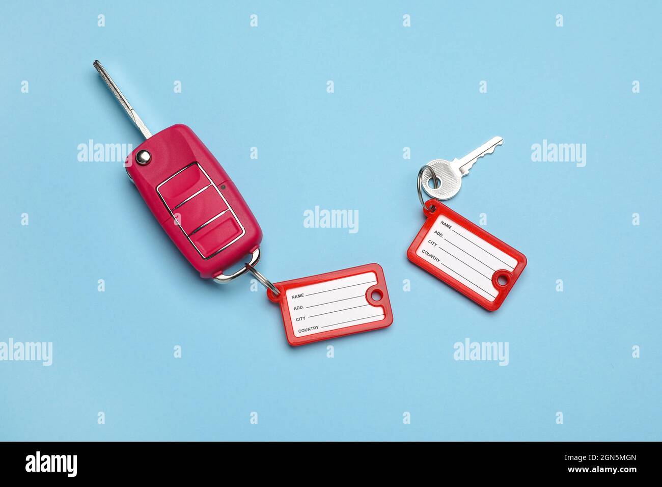 Keys with plastic tags on color background Stock Photo