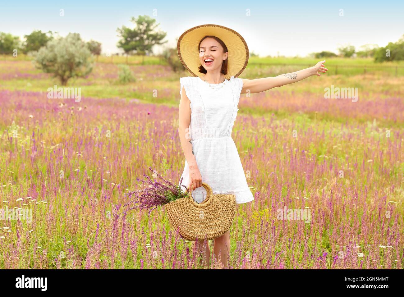 Beautiful Young Woman With Flowers In Bag On Summer Day Stock Photo Alamy beautiful-young-woman-with-flowers-in-bag-on-summer-day-stock-photo-alamy