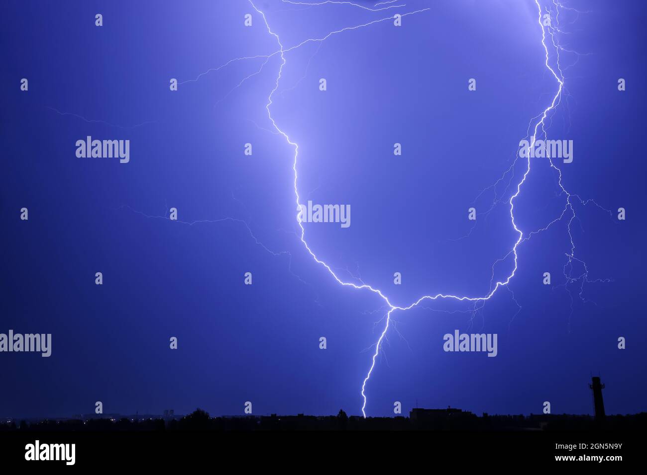 Dark sky with lightning over night city Stock Photo - Alamy