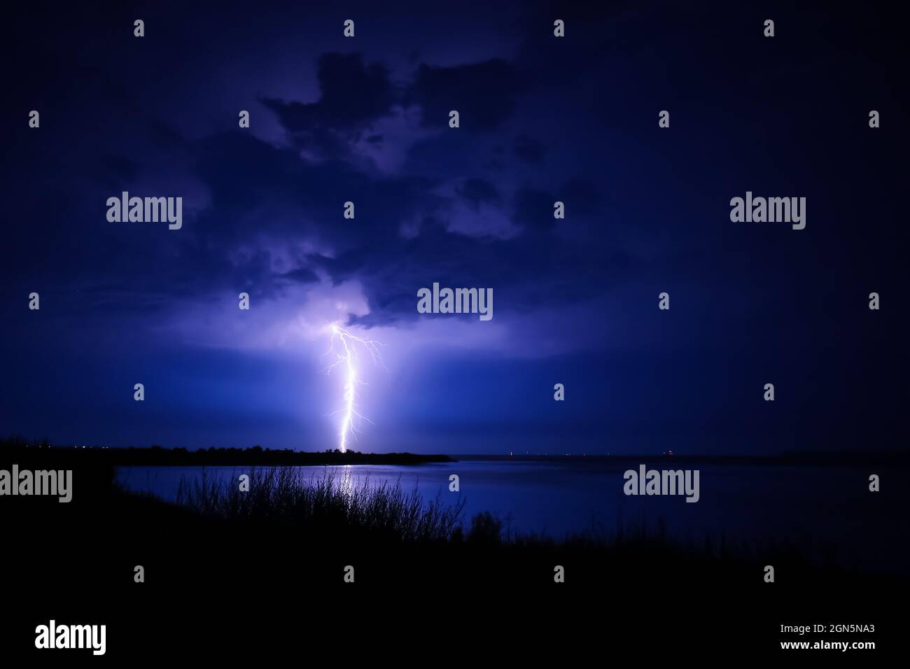 Dark sky with lightning over night city Stock Photo - Alamy