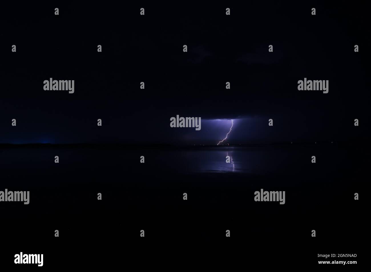 Dark sky with lightning over night city Stock Photo - Alamy