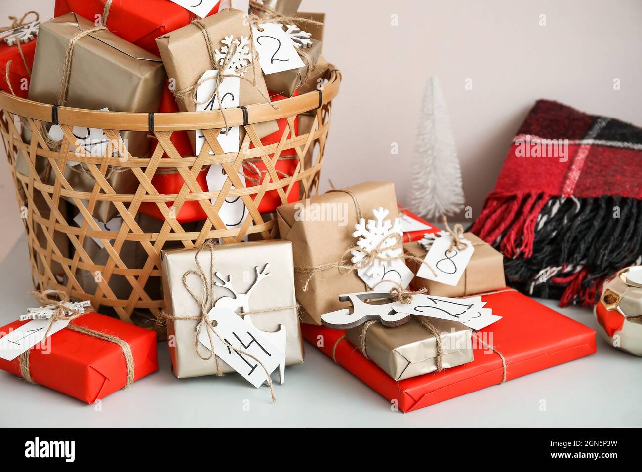 Dte Christmas Basket 2022 Christmas Advent Calendar With Gift Boxes In Basket And Plaid On Chest Of  Drawers, Closeup Stock Photo - Alamy