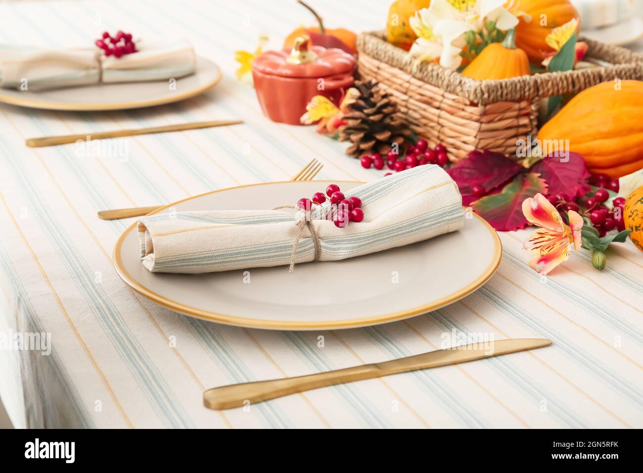 Stylish table setting with autumn decor in restaurant Stock Photo