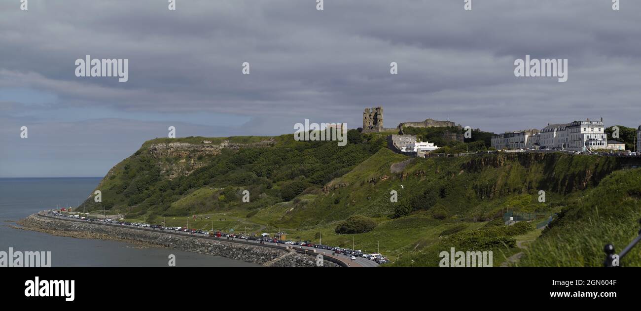 Scarbourough Castle is a former medieval Royal fortress situated on a rocky promontory overlooking the North Sea on the English coast. Stock Photo