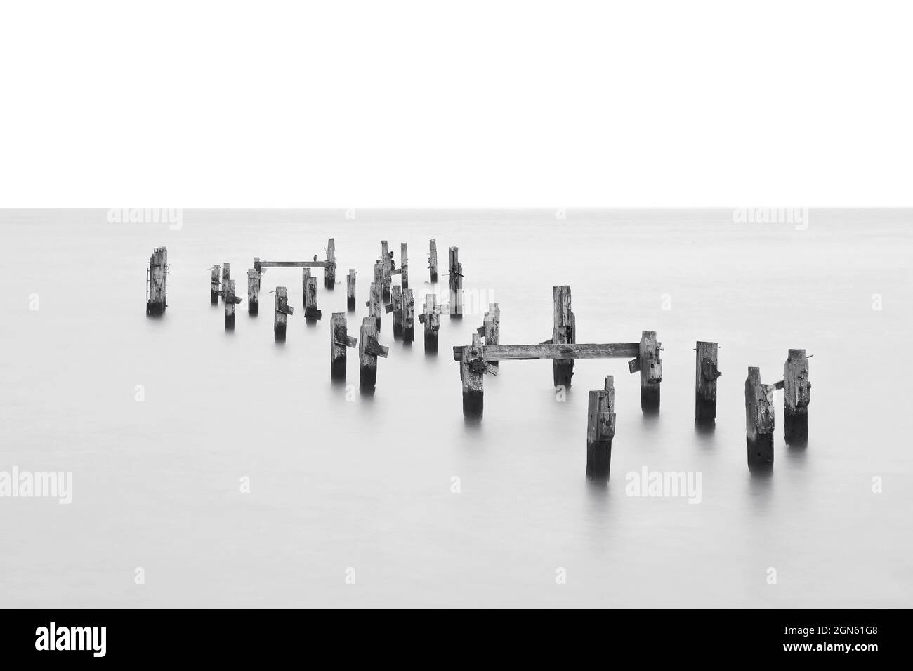 A Monochrome long exposure image showcasing Swanage Old Pier, Dorset. Stock Photo