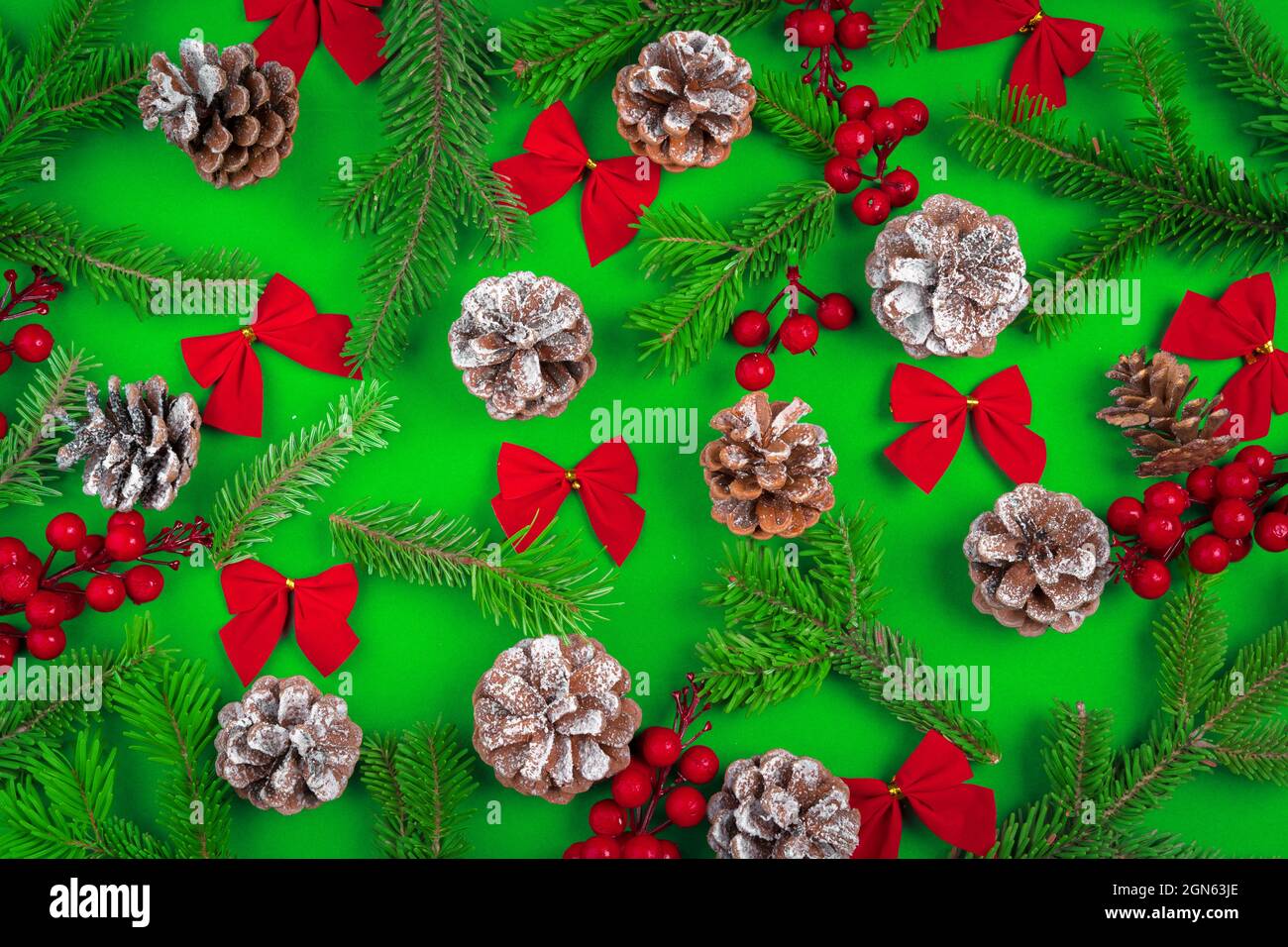 Christmas background with cones and pine branches on green Stock Photo ...