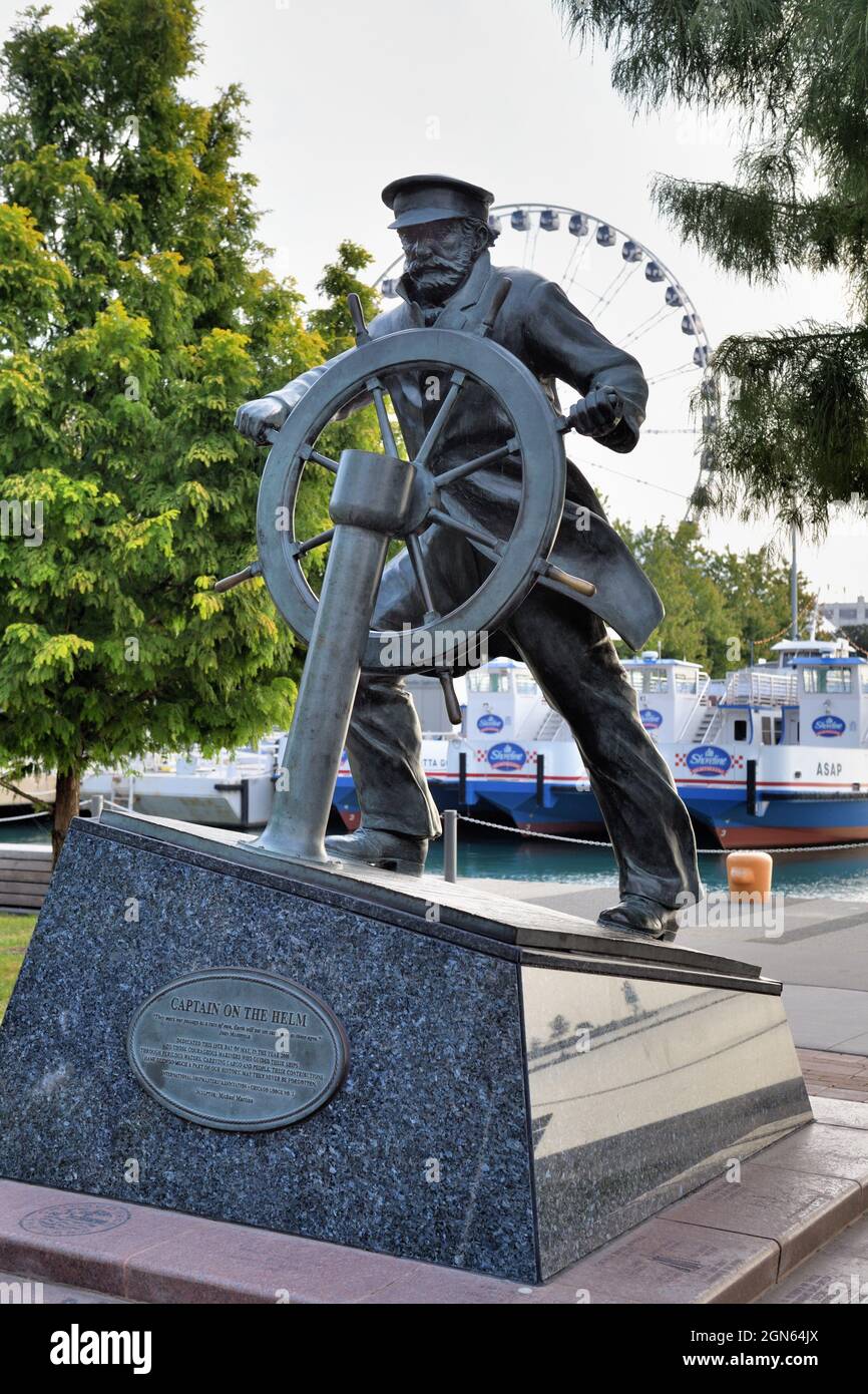 Chicago, Illinois, USA. 'Captain on the Helm' (also known as 'Captain at the Helm') is located in a park area at the west end of Navy Pier. Stock Photo
