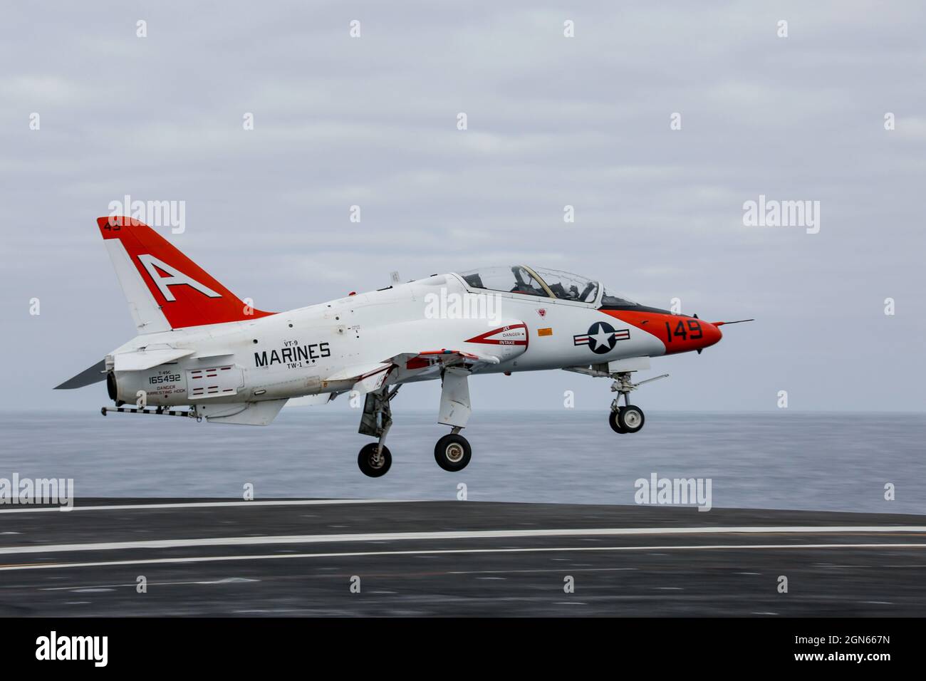 PACIFIC OCEAN (Sep. 2, 2021) A T-45C Goshawk, assigned to Training Air Wing 1 out of Naval Air Station Kingsville, Texas, performs a touch-and-go on the flight deck of the aircraft carrier USS Abraham Lincoln (CVN 72). Abraham Lincoln is underway conducting routine operations in the U.S. 3rd Fleet area of operations. (U.S. Navy photo by Mass Communication Specialist 3rd Class Michael Singley/Released) Stock Photo