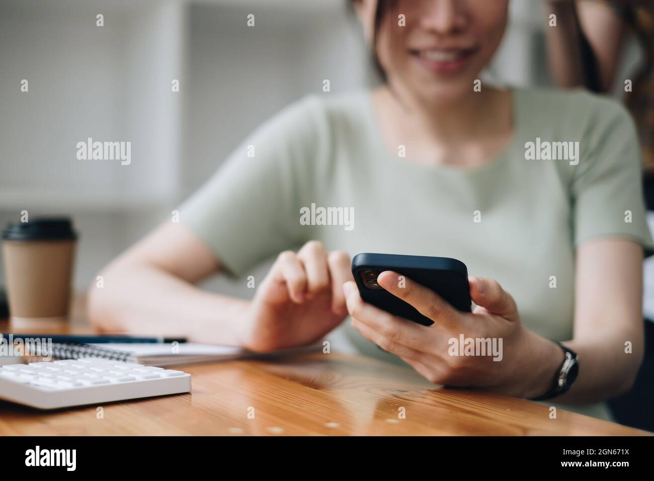 Woman scan her face for KYC security her saving bank account. Biometric data security concept. Stock Photo