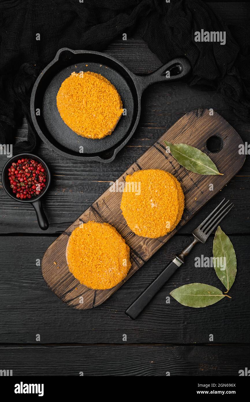 Raw fishcake Breaded set, on black wooden table background, top view ...