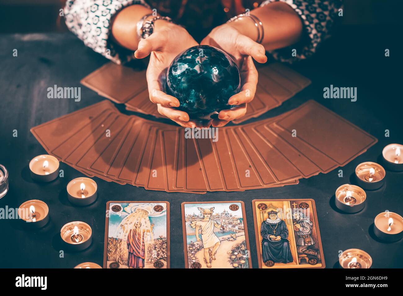 Fortune Teller With Tarot Cards On Table Near Burning Candles Tarot 