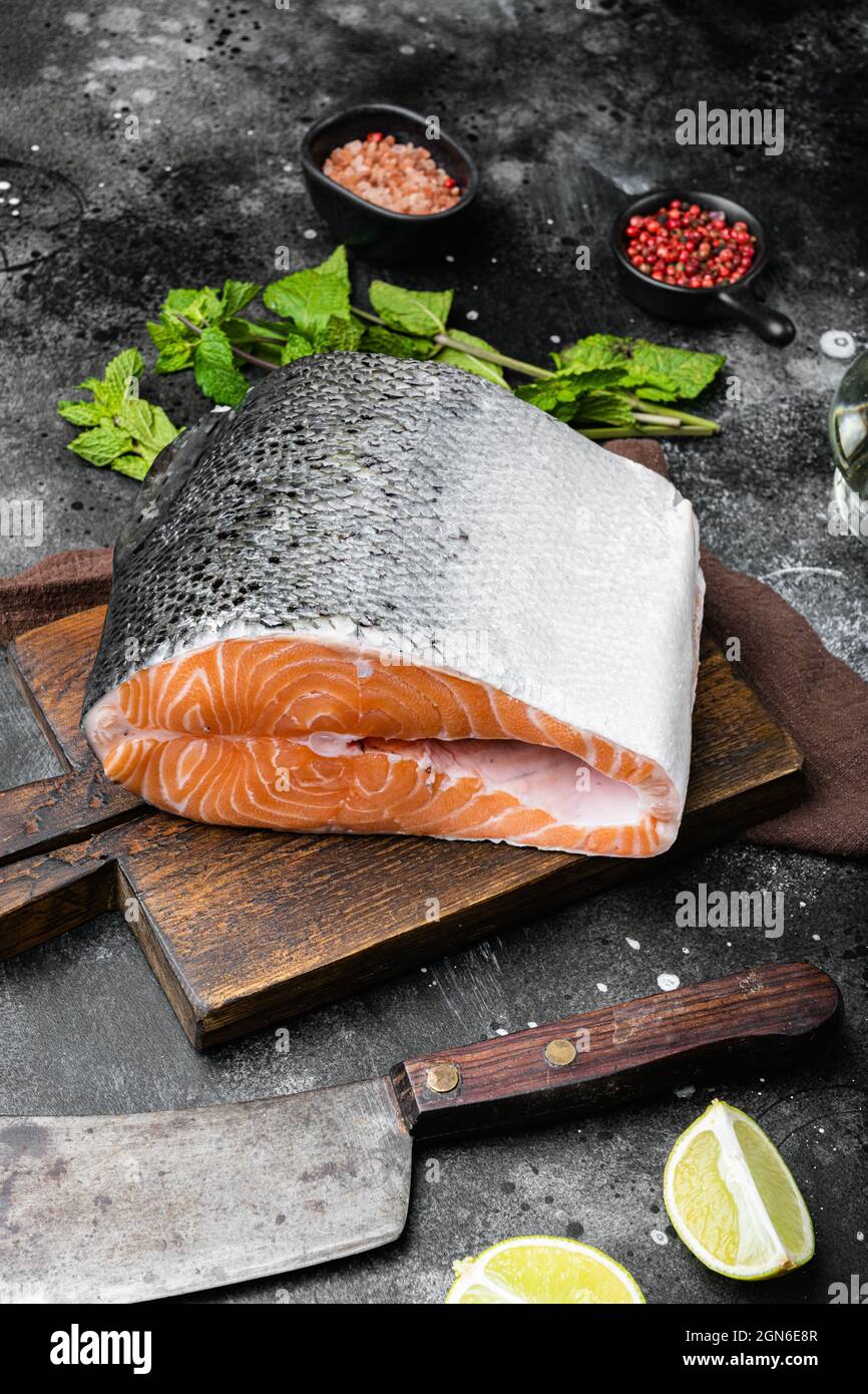 Salmon cut set, on black dark stone table background Stock Photo - Alamy