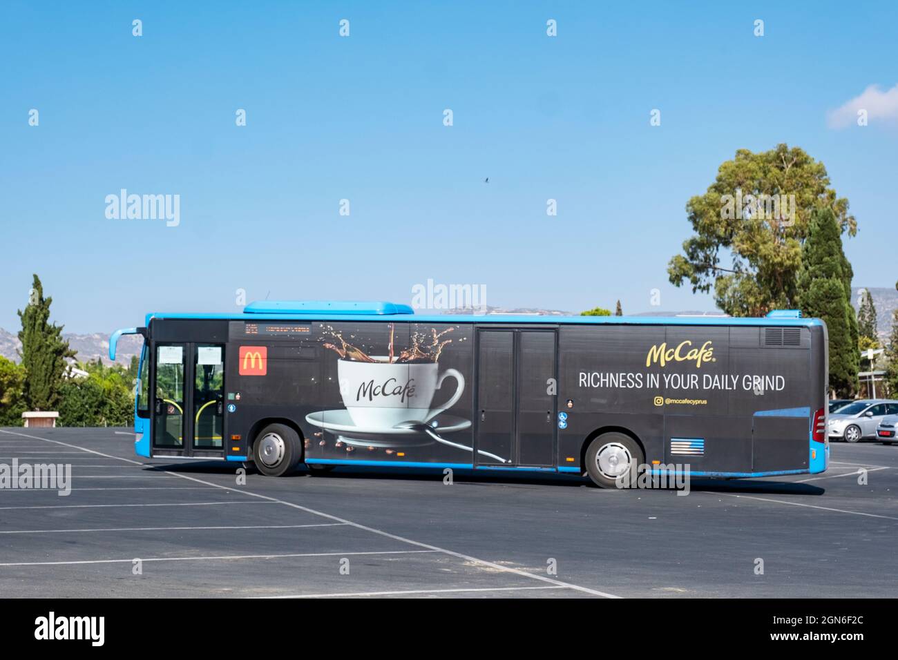 McDonalds McCafe advert on the side of a bus at Coral Bay, Paphos, Cyprus. Stock Photo