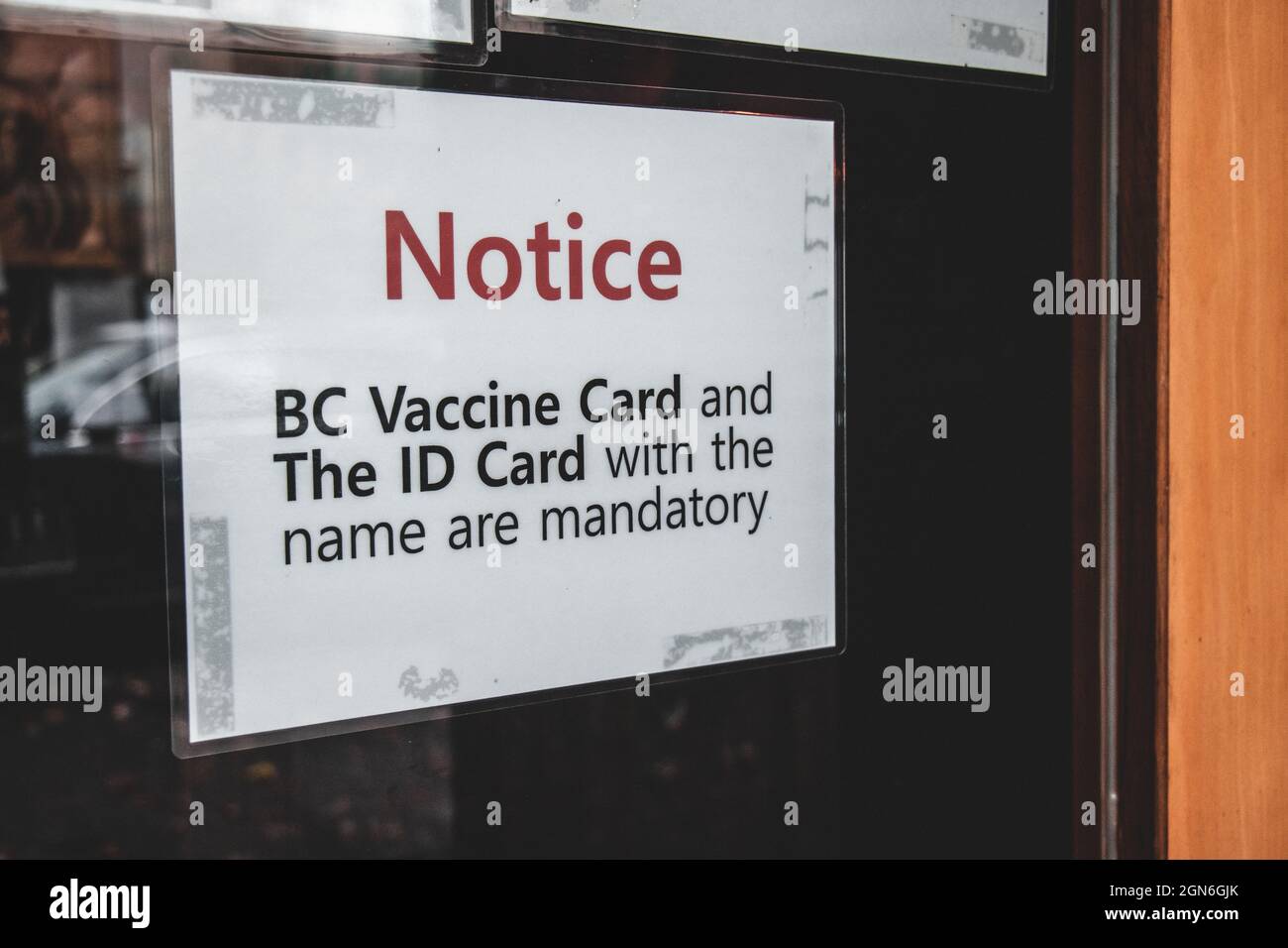View of sign at the entrance of local restaurant BC Vaccine Card and ID ...