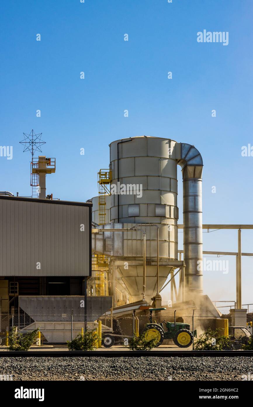 An Almond shelling facility in Westley California with huge piles of