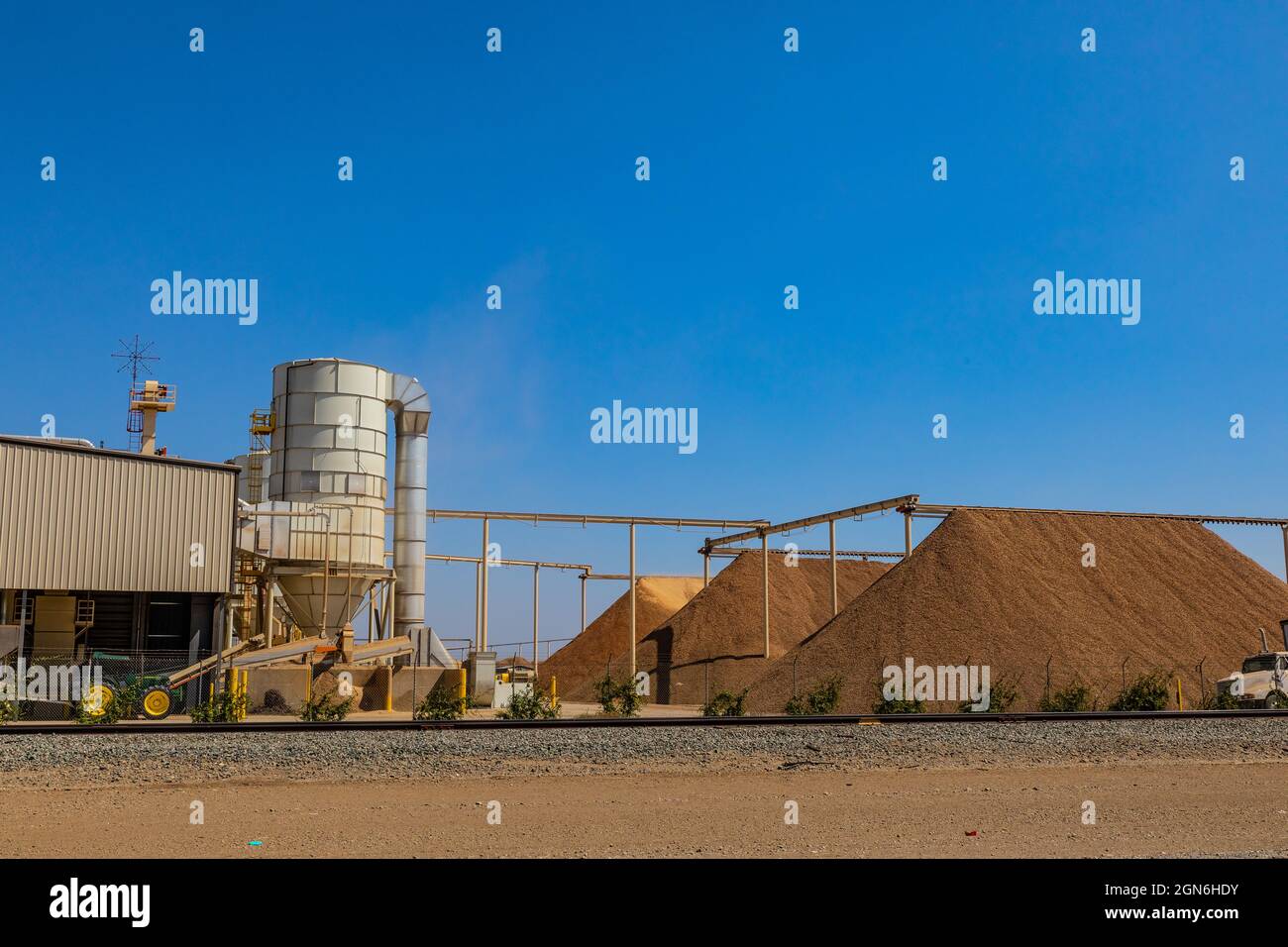 An Almond shelling facility in Westley California with huge piles of