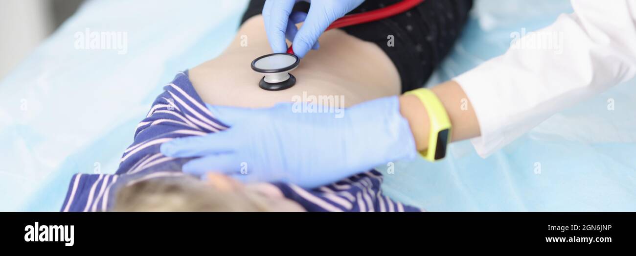 Doctor diagnoses lungs with stethoscope of little girl Stock Photo