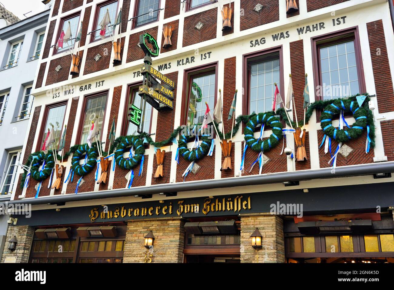 The traditional family-owned craft brewery 'Zum Schlüssel' in the popular tourist area Düsseldorf old town, decorated for 'Oktoberfest' weeks. Stock Photo