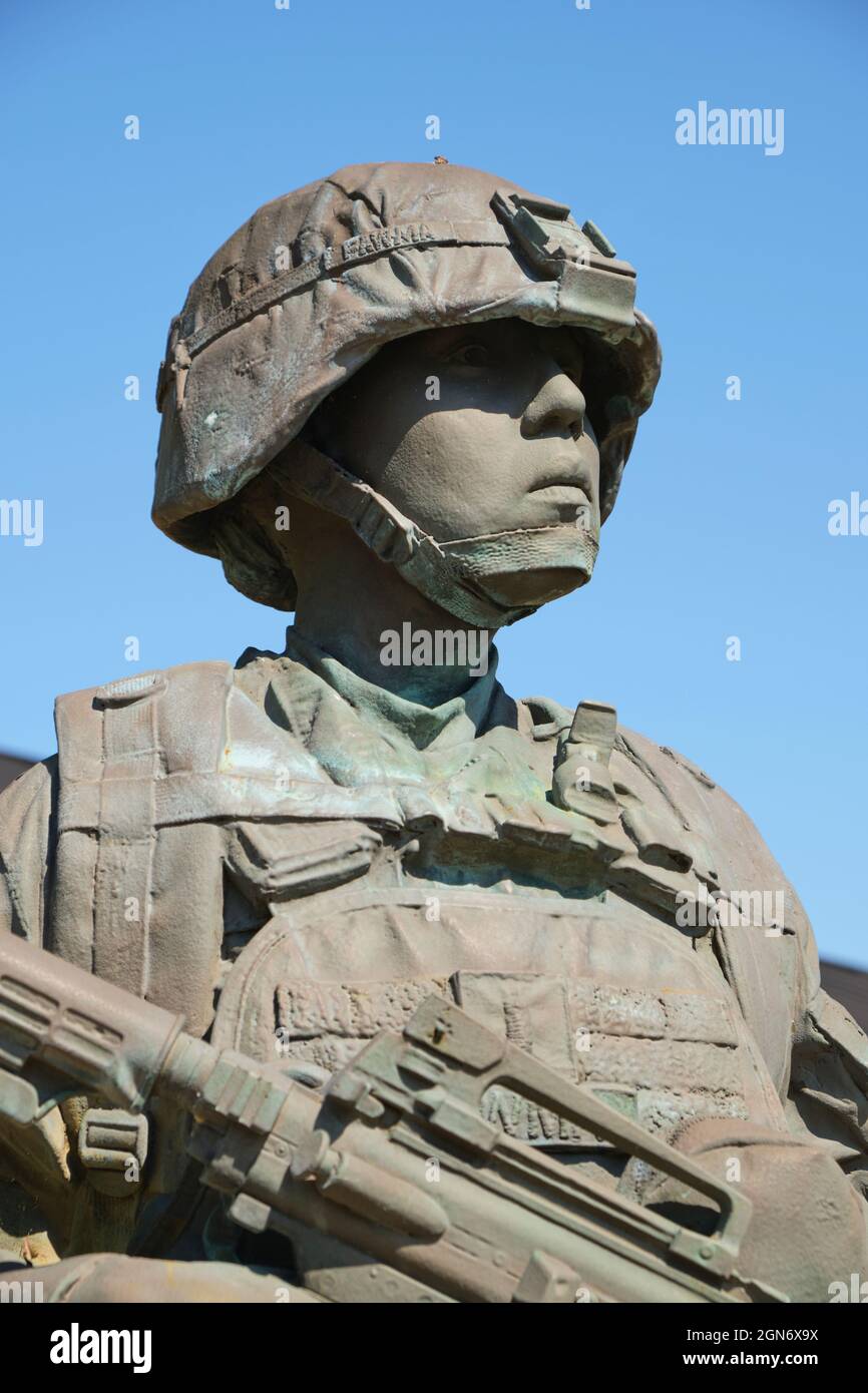 Detail of a bronze statue of a soldier at front entrance to the US Army Womens Museum at Fort Lee, Virginia. Stock Photo