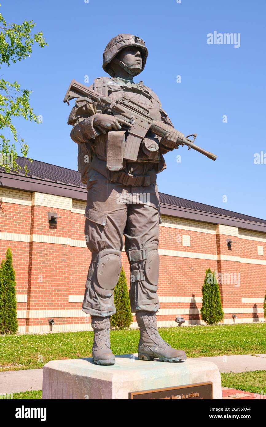 A bronze statue of a soldier at front entrance to the US Army Womens Museum at Fort Lee, Virginia. Stock Photo