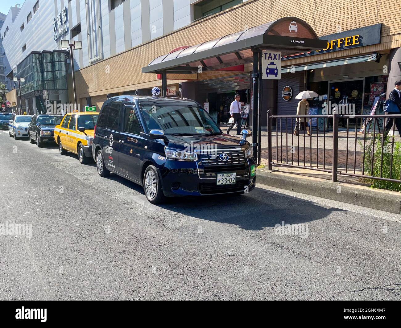 Tokyo, Japan - 23 November 2019: Japanese Taxi Cab Toyota JPN Taxi with Tokyo Olympic 2020 logo on it Stock Photo