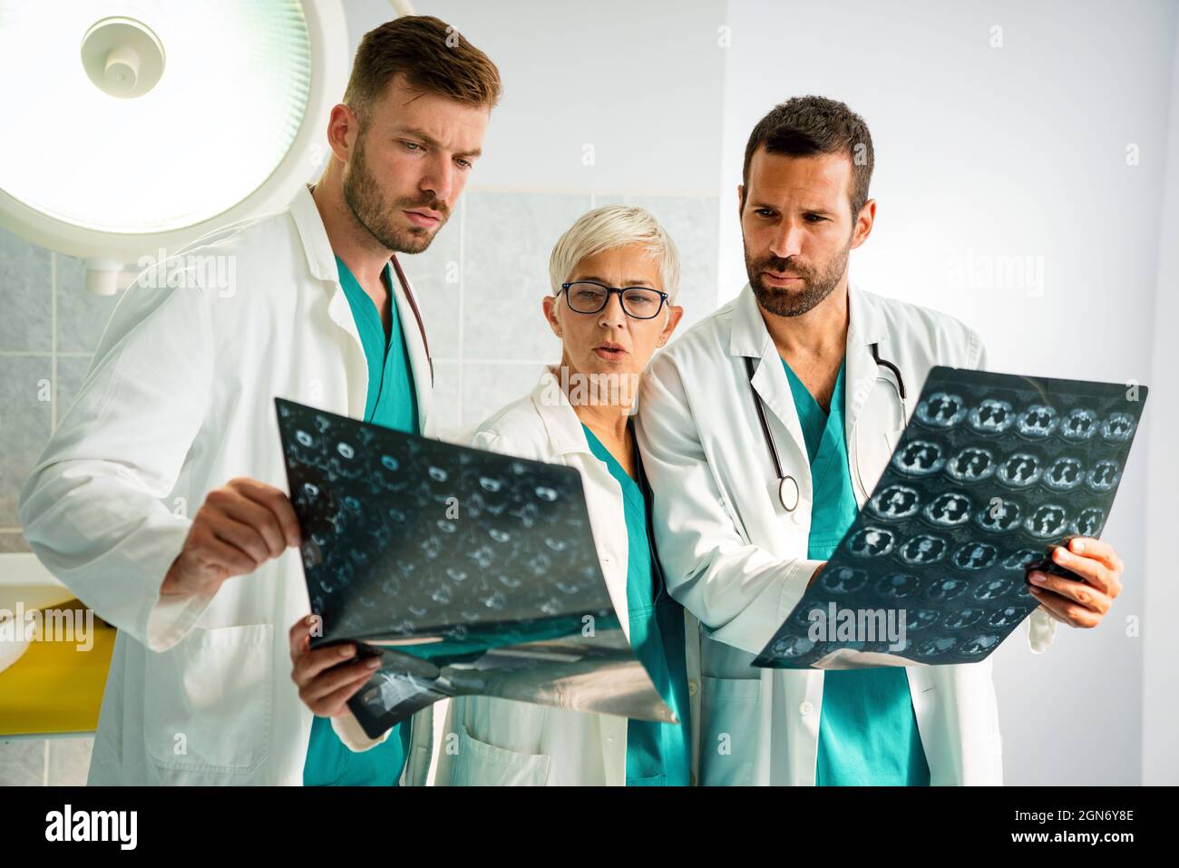 Radiologist doctor consulting with colleagues an xray scan in hospital