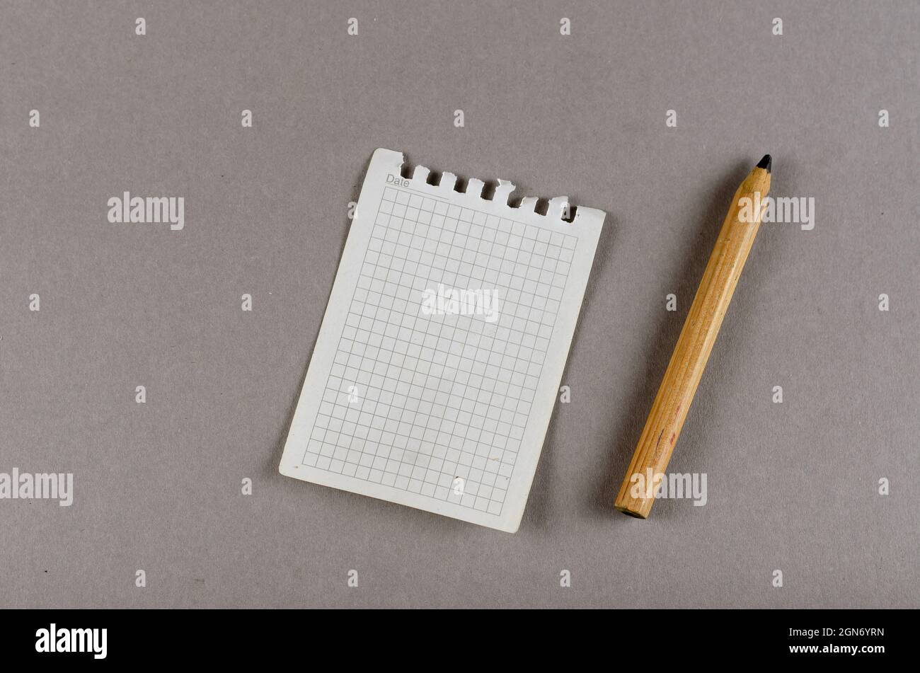 Sheet of paper torn from spring-loaded notebook and wooden penci Stock ...