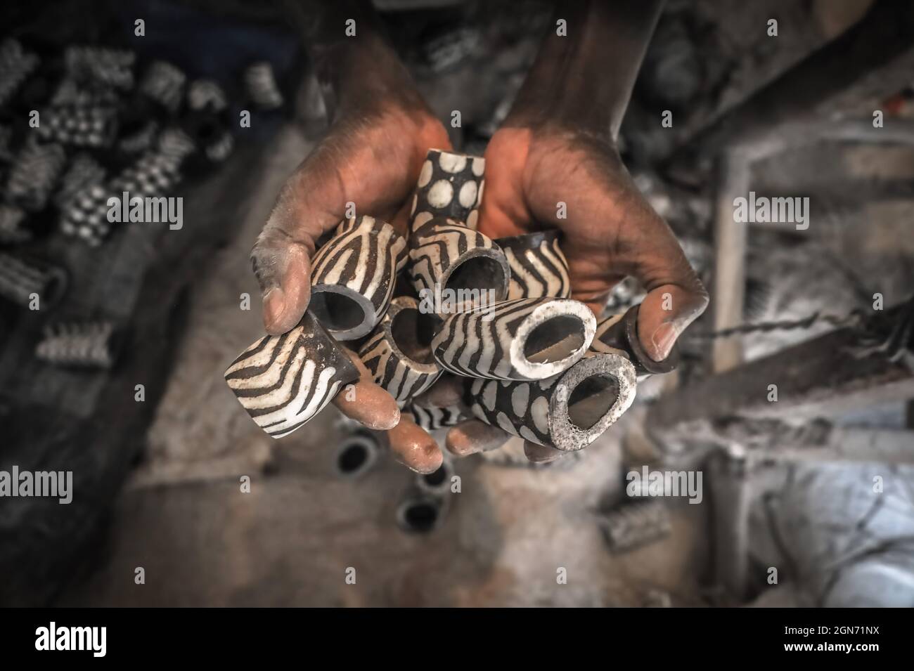 Nairobi, Kenya. 3rd Sep, 2021. A worker at The African Bone Crafts holds  unfinished salt shakers made from recycled  group of artisans from  The African Bone Craft in Nairobi's Kibera slums