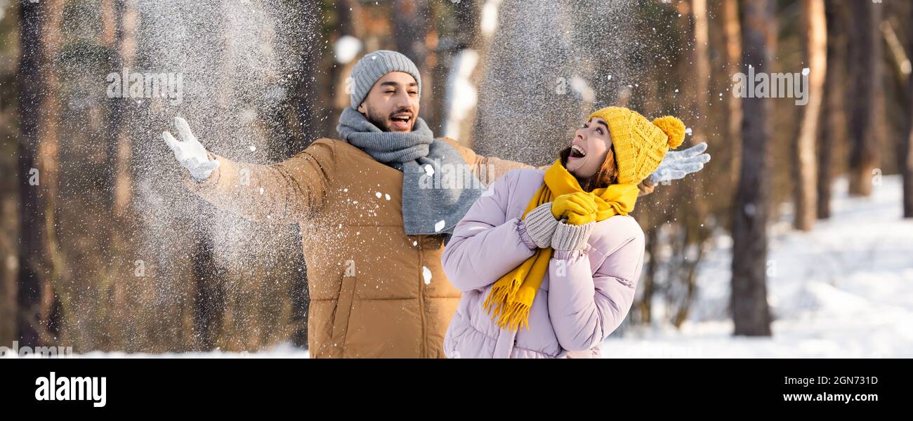 Young couple throwing snow in hi-res stock photography and images - Alamy