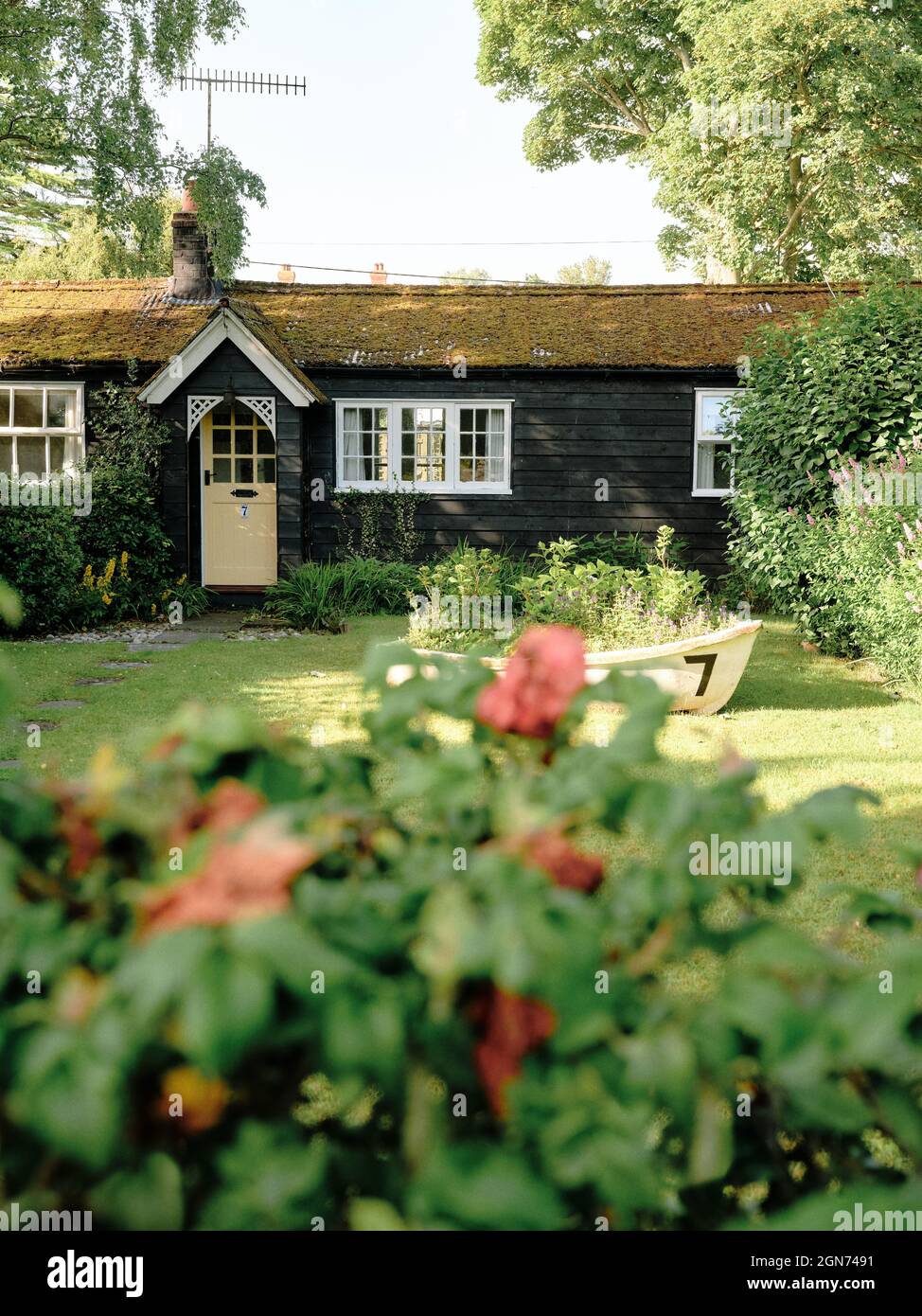 Black timber houses and gardens in Thorpeness a seaside village in East