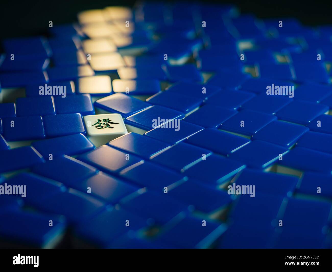 Blue mahjong tiles with fortune lit up fa Stock Photo