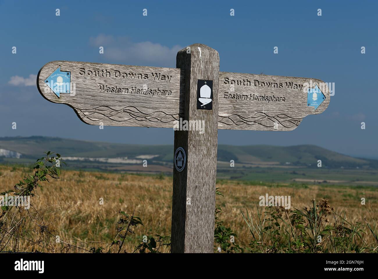 Wooden sign on South Downs way in Sussex marking the Greenwich Meridian Stock Photo