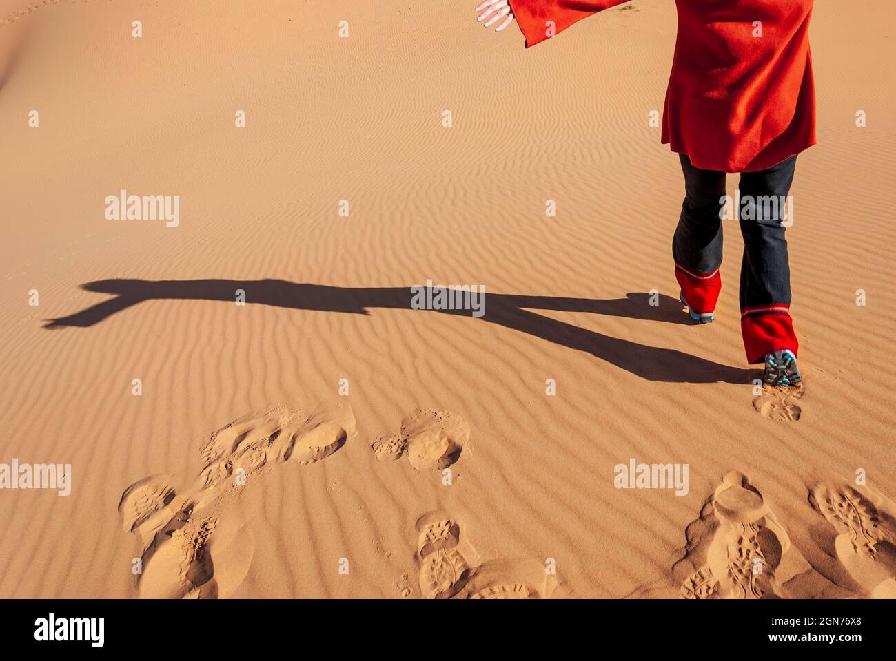 woman running happily down a desert dune Stock Photo - Alamy