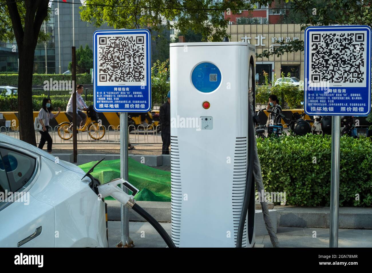 A Tesla Model3 is charging at a new charging station in Beijing, China. 23-Sep-2021 Stock Photo