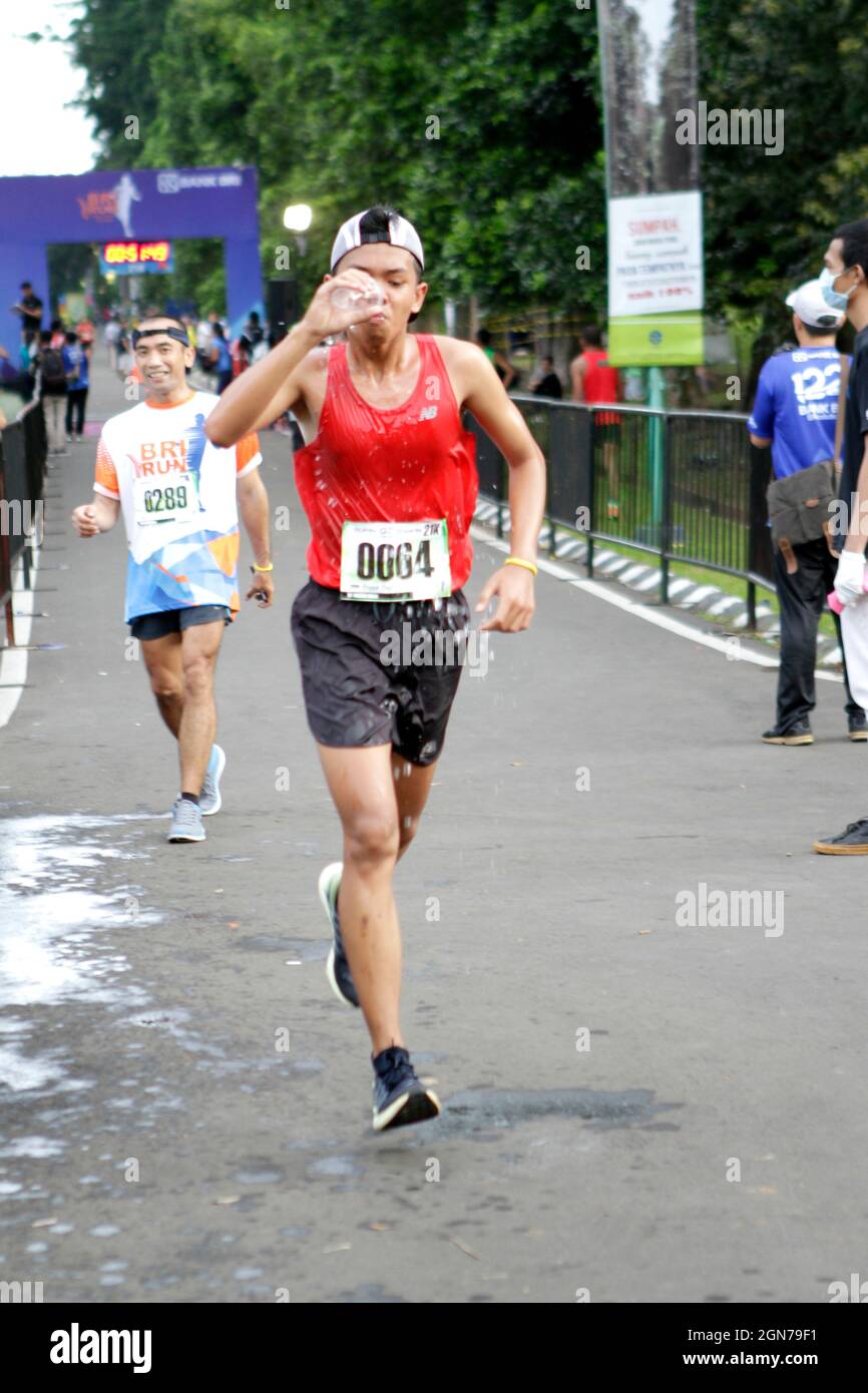 a photo of a marathon running competition held by one of the Indonesian government banks. Stock Photo