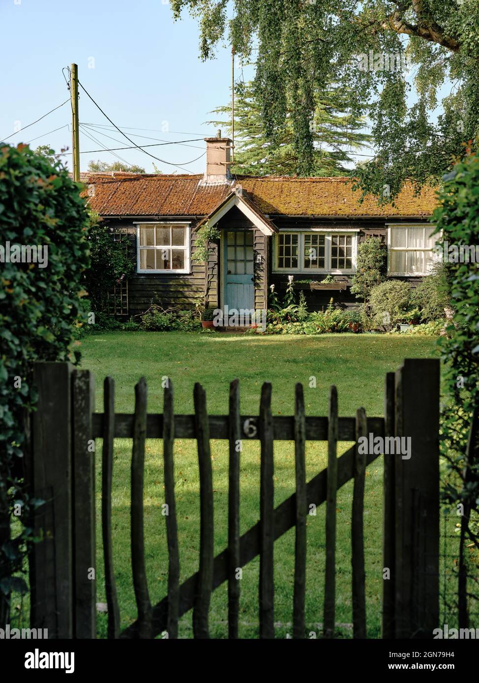 Black timber houses and gardens in Thorpeness a seaside village in East