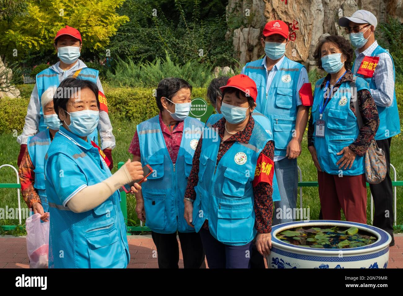 Red-armbanded neighbourhood watchers are seen in Xicheng district, Beijing, China. 23-Sep2021 Stock Photo