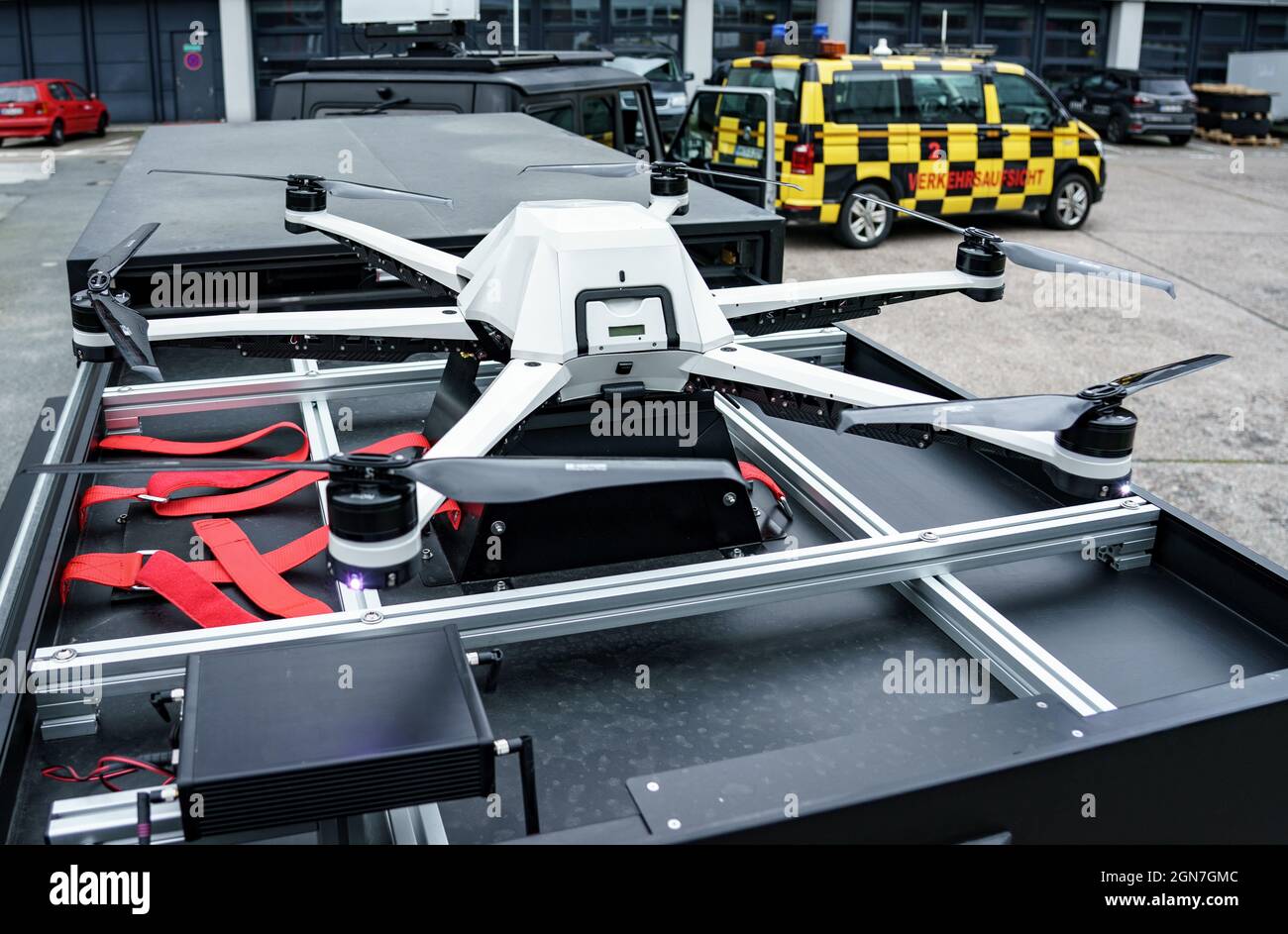 23 September 2021, Hamburg: A drone from the "Falke" project lies on a  trailer on the grounds of Hamburg Airport. The project aims to realize the  hunt for a drone entering the