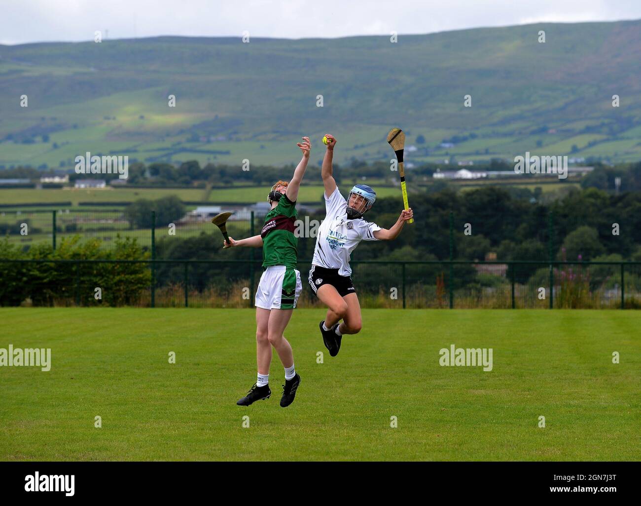 GAA hurling game Na Magha (in green) v Kevin Lynchs. ©George Sweeney / Alamy Stock Photo Stock Photo