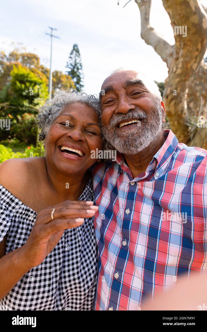Happy african american senior couple taking selfie and hugging Stock ...