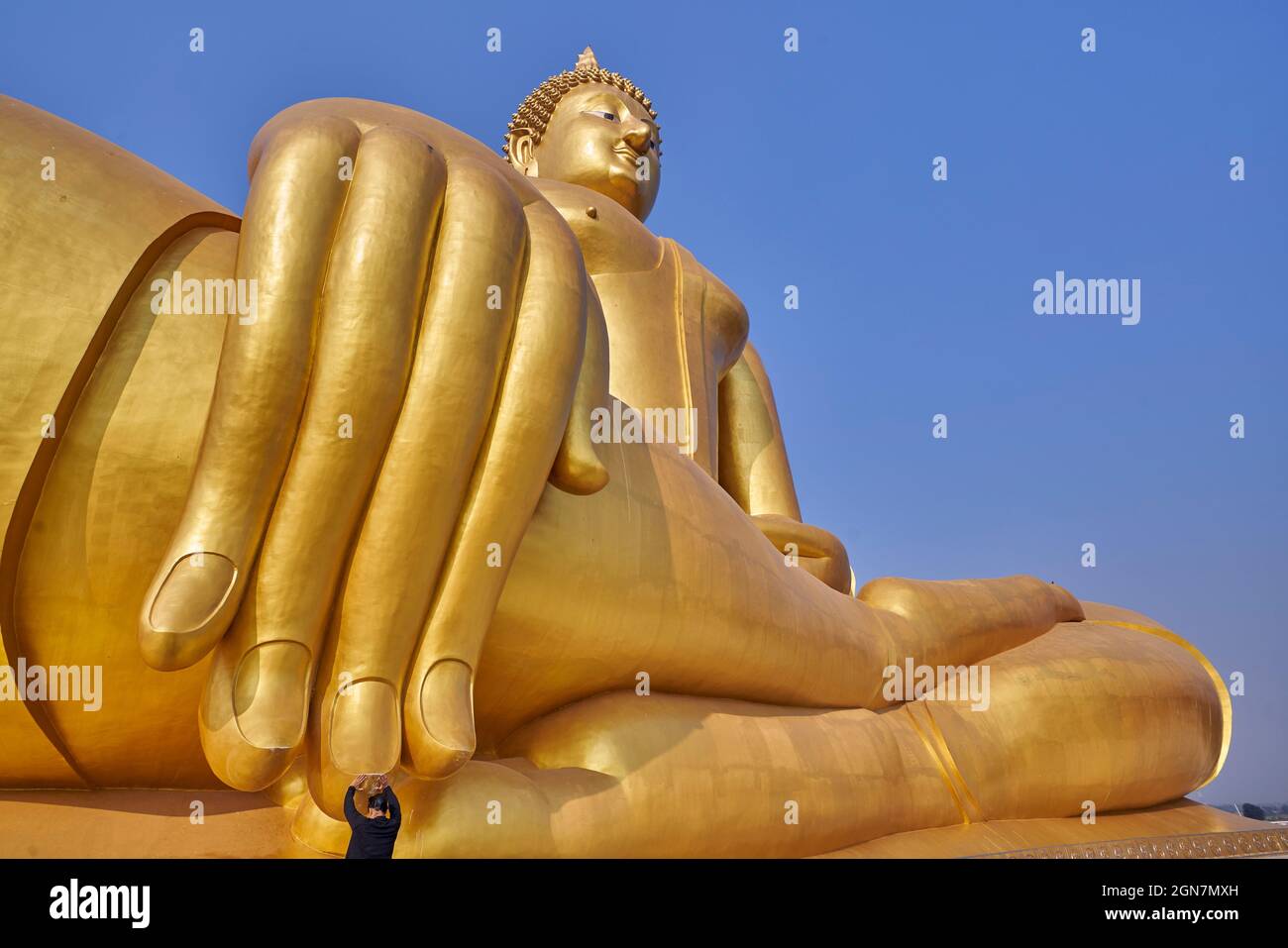 Buddhist woman at the Great Buddha of Thailand Stock Photo