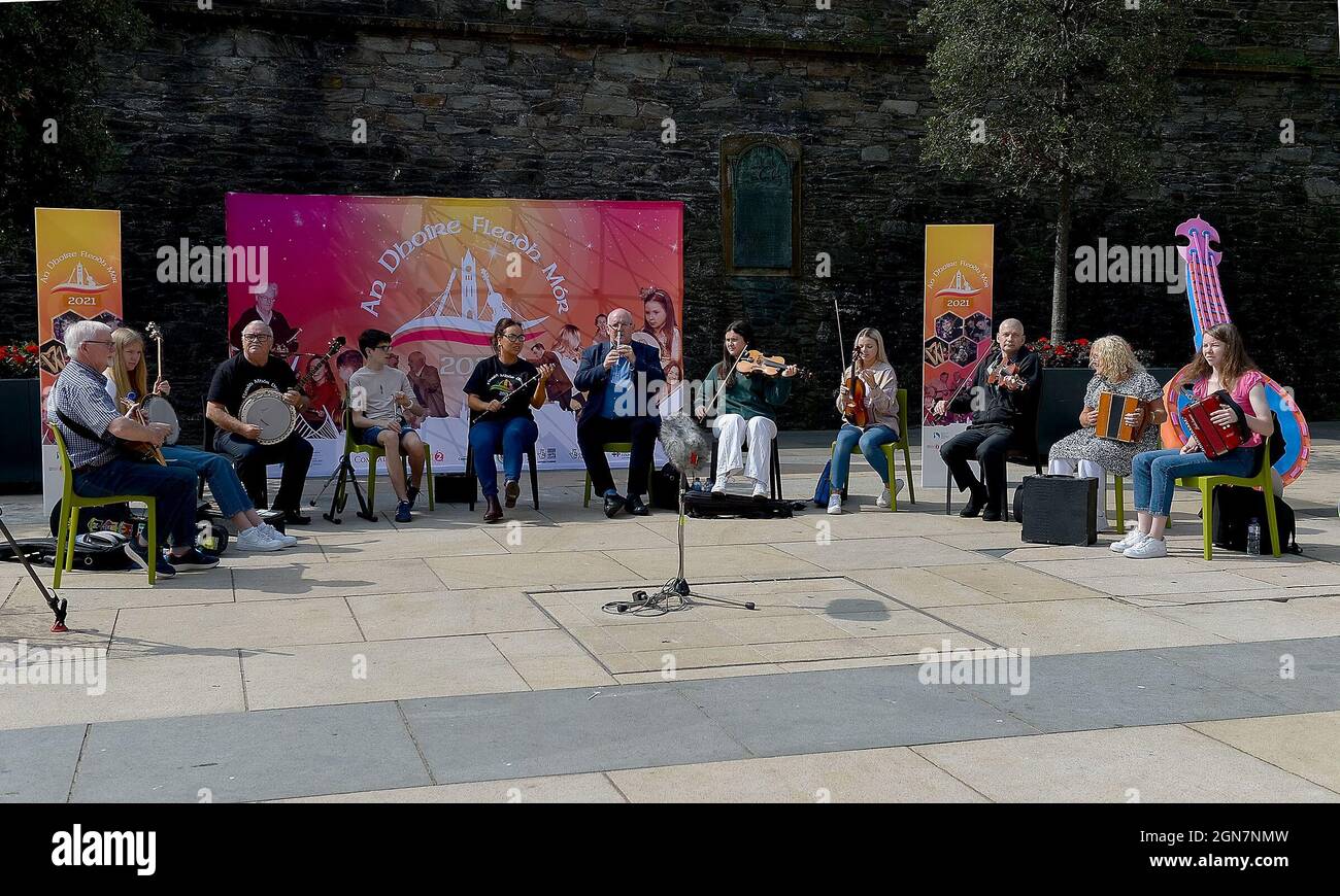 Irish musicians playing traditional music in Guildhall Square, Derry, Northern Ireland 2021. ©George Sweeney / Alamy Stock Photo Stock Photo