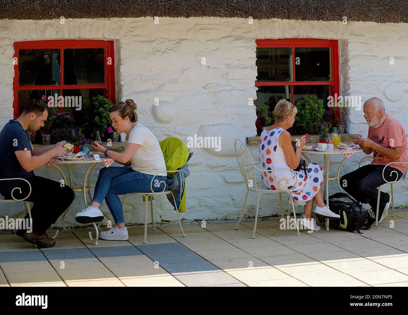 Adults dining outdoors in the Craft village in Derry, Northern Ireland 2021. ©George Sweeney / Alamy Stock Photo Stock Photo