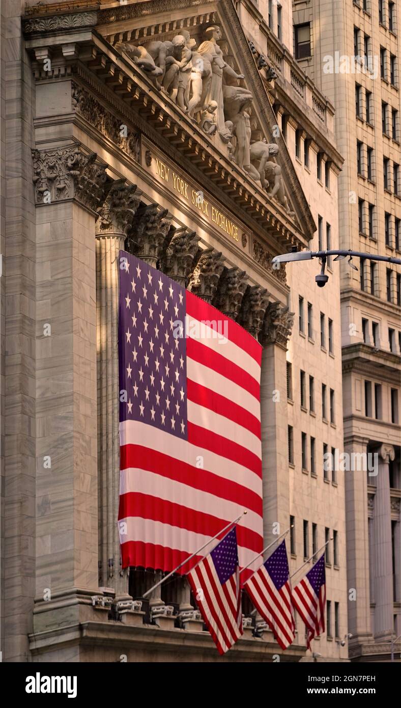 large American flag flying in front of the New York Stock exchange