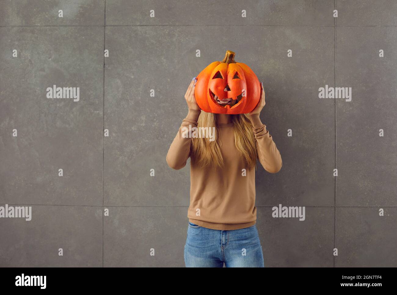 Preparing for Halloween. Teenage kid hands cutting black paper bat with  scissors and making Halloween party decorations on white table at home. Top  Stock Photo - Alamy